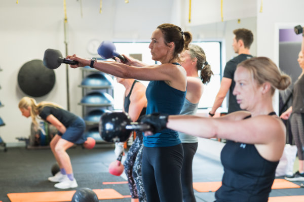 Photo of a small group gym class.
